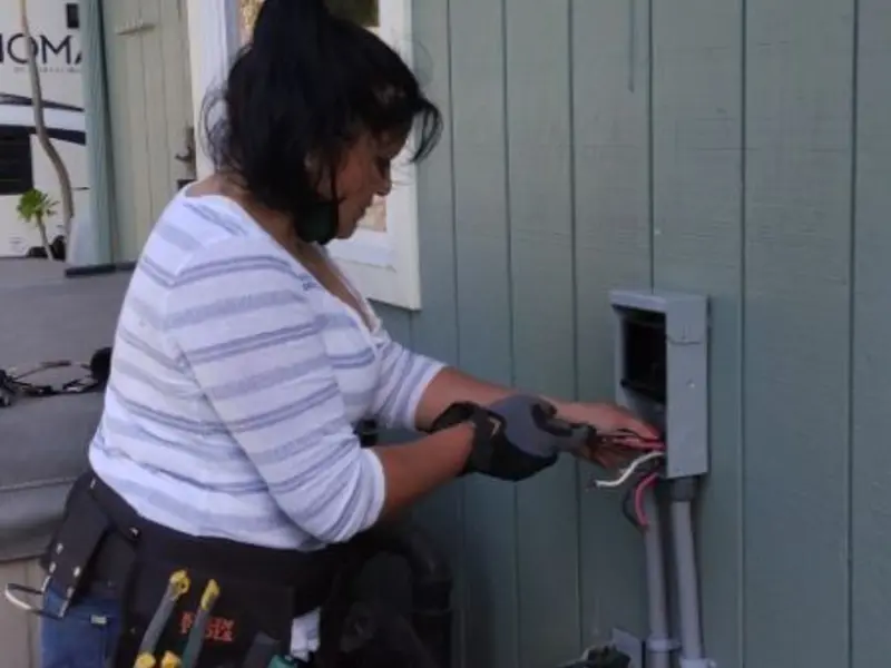 Licensed electrician wiring an exterior subpanel in Leavenworth